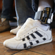 A father wears an ankle bracelet as he is cared for in an Annunciation House facility after being reunited with his son on July 25, 2018 in El Paso, Texas. He was reunited with his son at an I.C.E processing center after being separated when they tried to cross into the United States